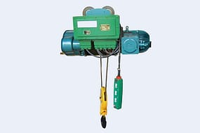  An explosion-proof wire rope electric hoist with a green motor housing, blue reel, and a yellow hook, equipped with a green pendant control.